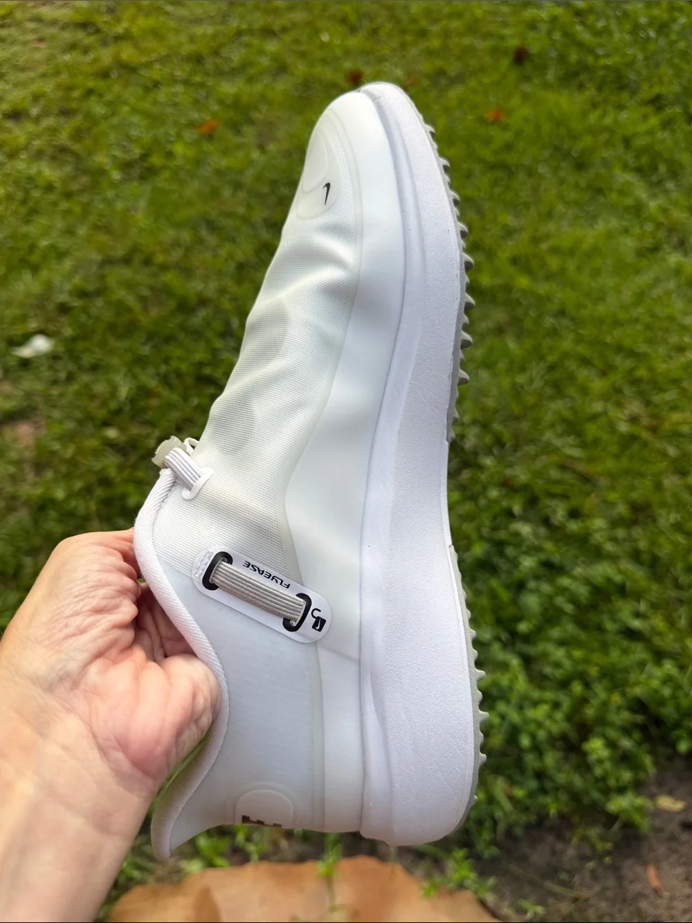 Nike Men’s White Slip-On Sneakers with Black Swoosh